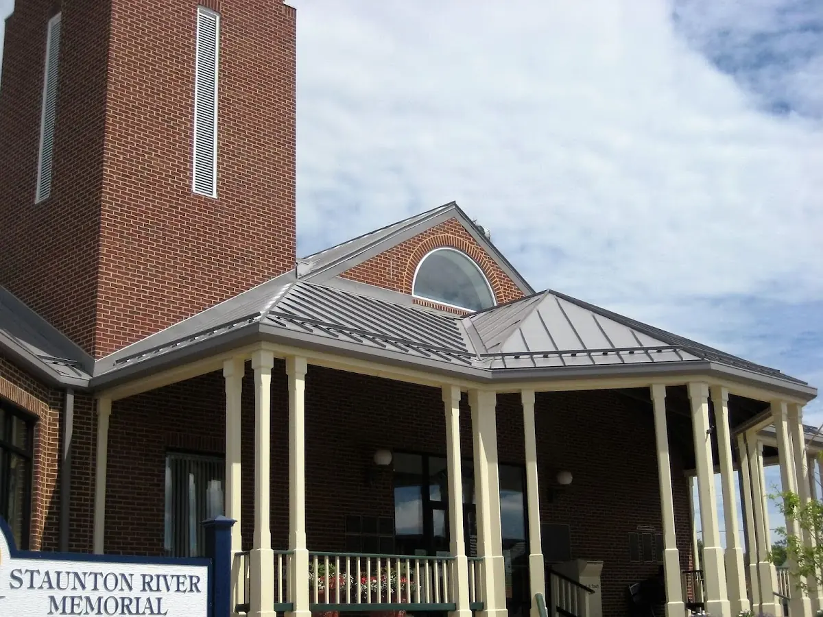 Skilled roofing craftsmen working on a residential roof in Socialville